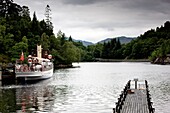 Scotland; Tour Boat And Wooden Pier Over Lake