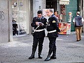 Two Middle-Aged Policemen On Street; Naples, Italy