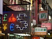 Neon Currency Sign On Street; Hong Kong, China