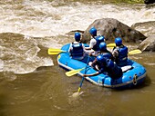 Rafters In Inflatable Raft By Rapid River