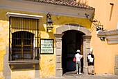 Hotel Convento Santa Catalina, Antigua, Guatemala, Central America; Tourist Outside Hotel Entrance
