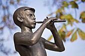A Statue Of A Boy Playing A Piccalo; Tivoli Park,Ljubljana,Slovenia