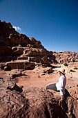 Man Sitting Near Monumental Nabataean Tombs
