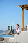 Young Woman On Poolside Terrace, Cabo San Lucas, Mexico