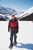 Woman On Snowshoes In The Snow