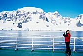 Tourist Admires View In The Neumayer Channel