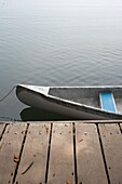 Canoe Tied To Jetty