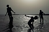 Silhouette Of Boys Fishing