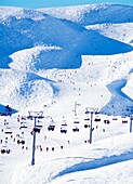 Crowded Slopes & Chairlift In The Alps