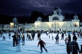 People Ice Skating At Night