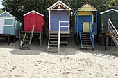 Colourful Beach Huts On Beach