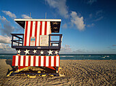 Lifeguard Tower At Dusk Painted In Stars And Stripes Design