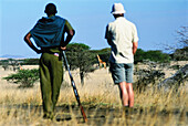 Walking Safari And Looking At A Giraffe