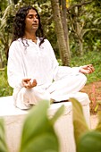 Man Meditating Outside In Rural Setting