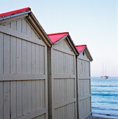 Beach Huts At Mondello, Leading To The Sea, With A Yacht In The Distance