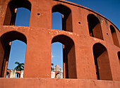 Looking Through Part Of The Jantar Mantar Observatory Towards The Office Blocks
