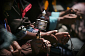 Hands And Spinning Prayer Wheel, Close Up