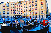 Gondoliers Sitting In Gondolas In Front Of Hotel Cavalletto