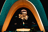 A-Bomb Dome Through Arched Peace Memorial Cenotaph At Night