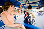 Woman Tourist Travelling By Tuk-Tuk.