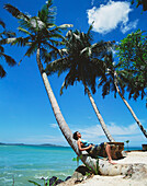Sunbathing Under Palm Trees