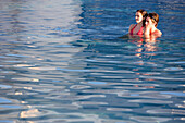 Couple In Swimming Pool.