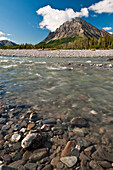 View Of North Fork Koyukuk River Flowing Over A Rocky Gravel Bar With Frigid Crags In The Background, Gates Of The Arctic National Park & Preserve, Arctic Alaska, Summer