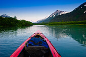 A Kayaker's Perspective While Crossing A Calm Lake At Sunset, Southcentral Alaska During Summer