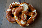 Pretzels on a wooden table; Zermatt valais switzerland