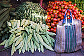 Assortment of vegetables and a shopping bag at devaraja market; Mysore karnataka india