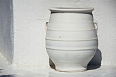 A White Pot Sits Beside A White Wall; Firostefani, Santorini, Cyclades, Greece