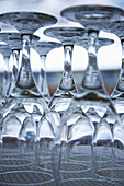 Clean Glass Stemware Placed Upside Down On A Shelf; France