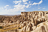 Fairy Chimneys And Cliffs In A Rugged, Barren Landscape In Deverent Valley; Cappadocia, Turkey