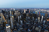 Panoramic View Of The Skyscrapers And The East River At Dusk, As Seen From The Empire State Building, New York City, New York, United States