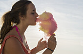 Teenage Girl Eating Candy Floss; England