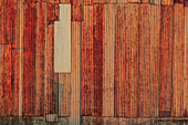 Close-up of rusted corrugated metal panels.