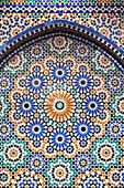 Morocco, Fes. A detail of a mosaic tiled fountain.