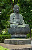 Tokyo, Japan. Quiet area with Buddha statue at Sensoji Temple at Tokyo's oldest temple
