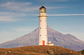 New Zealand, North Island, Pungarehu. Cape Egmont Lighthouse and Mt. Taranaki
