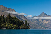 New Zealand, South Island, Otago, Queenstown, harbor view with The Remarkables Mountains