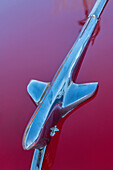 Detail of hood ornament on red classic American car in Habana, Havana, Cuba.