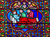 King Death Bed Angels Medieval Stories stained glass, Notre Dame Cathedral, Paris, France. Notre Dame was built between 1163 and 1250 AD.