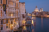Twilight over the buildings along the Grand Canal with Santa Maria della Salute, Venice, Veneto, Italy
