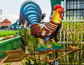 Brass Rooster Wind vane Zaanse Schans Old Windmill Village Countryside, Holland, Netherlands. Working windmills from the 16th to 18th century on the River Zaan.