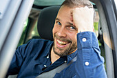 Portrait of smiling young man enjoying road trip