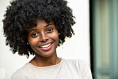 Portrait of smiling young woman in park