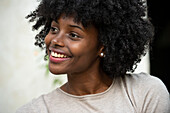 Smiling young woman looking away in park