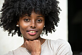 Portrait of smiling young woman in park