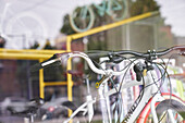 Shot of bicycles seen through shop window