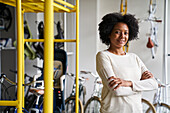 Mid-shot portrait of female African-American bicycle shop owner
